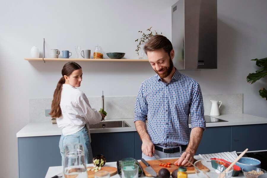 medium-shot-couple-cooking-together_23-2149048141